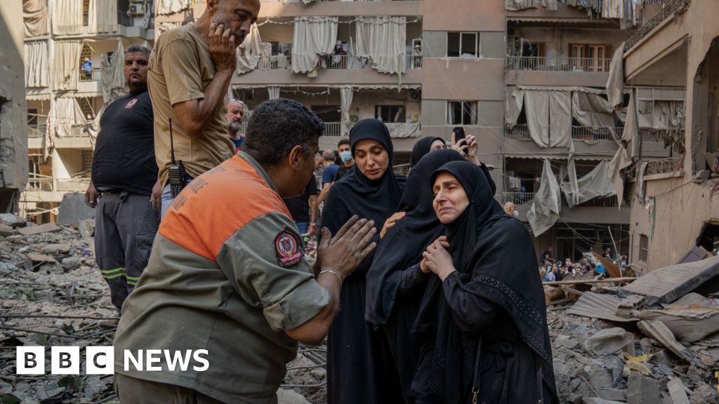 Rescue workers search for signs of missing under rubble