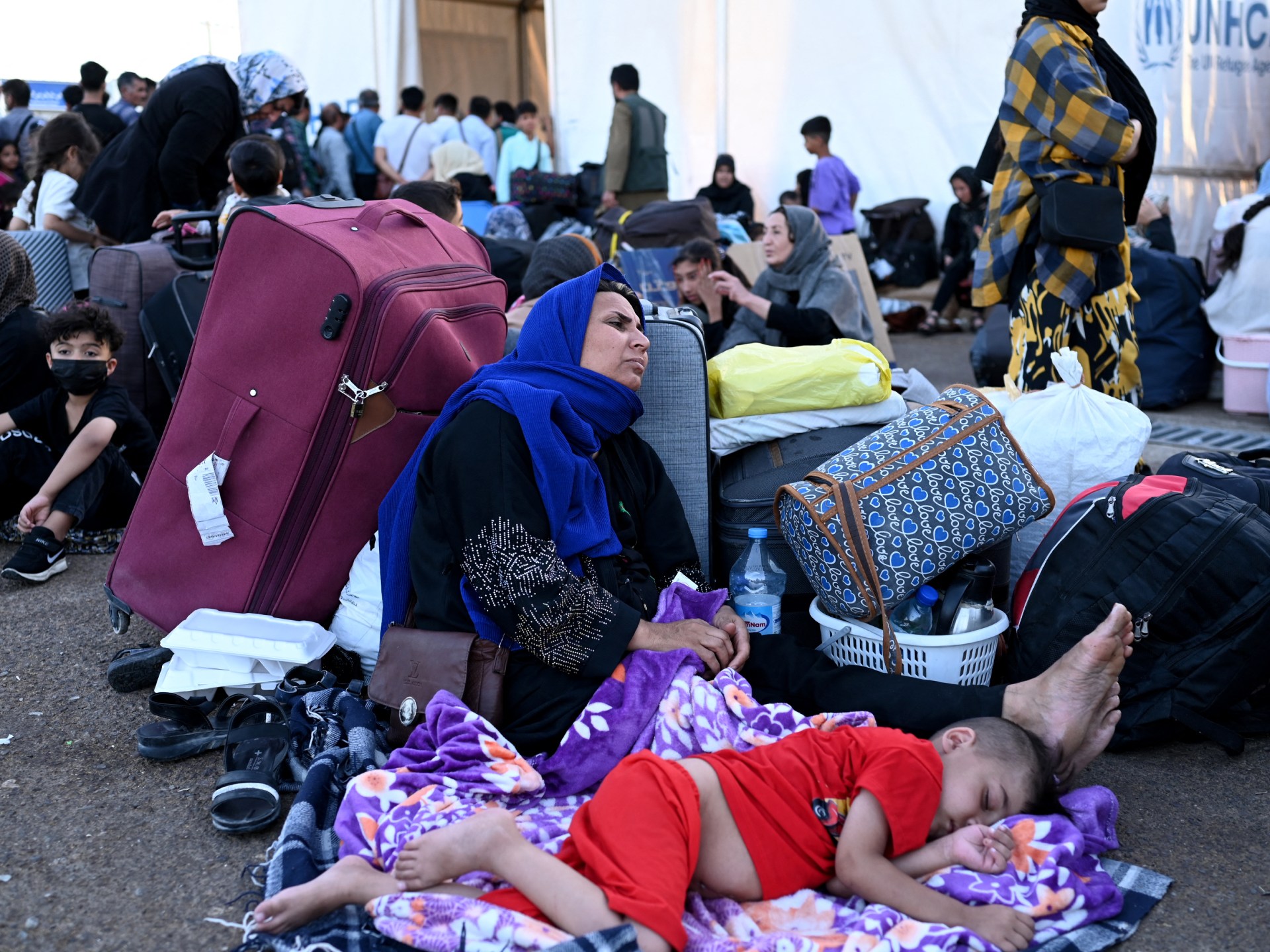 Nearly half a million Afghans return from Iran after crackdown | Refugees News